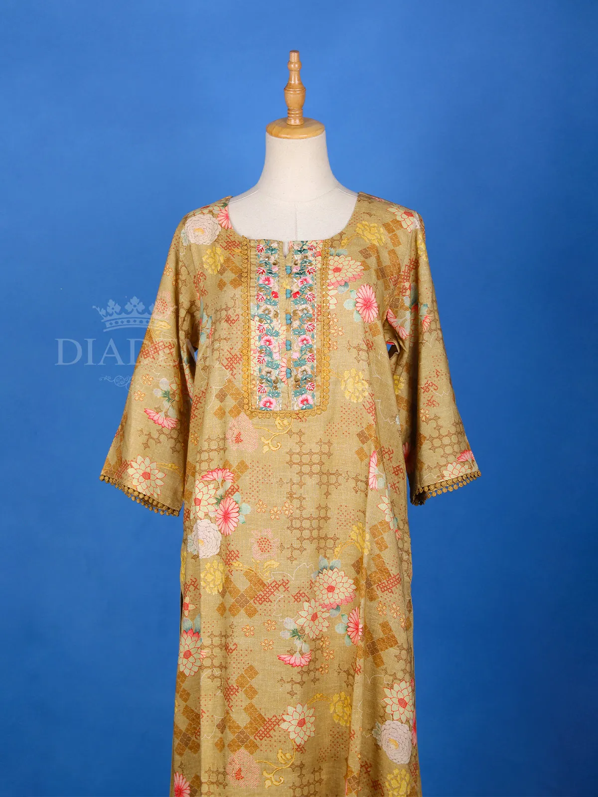 Brown Cotton Straight Cut Salwar Suit Adorned with Floral Prints and Lace With 3/4 Sleeves